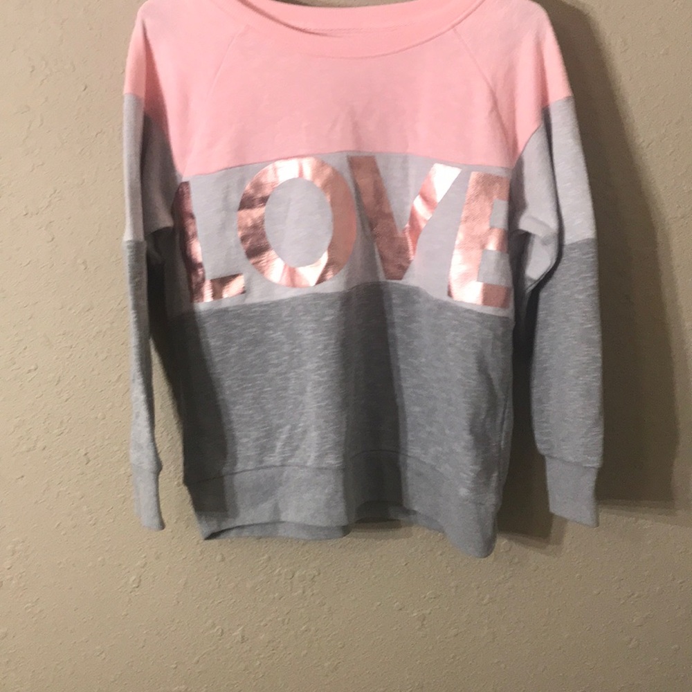 This is a white pink and grey sweatshirt